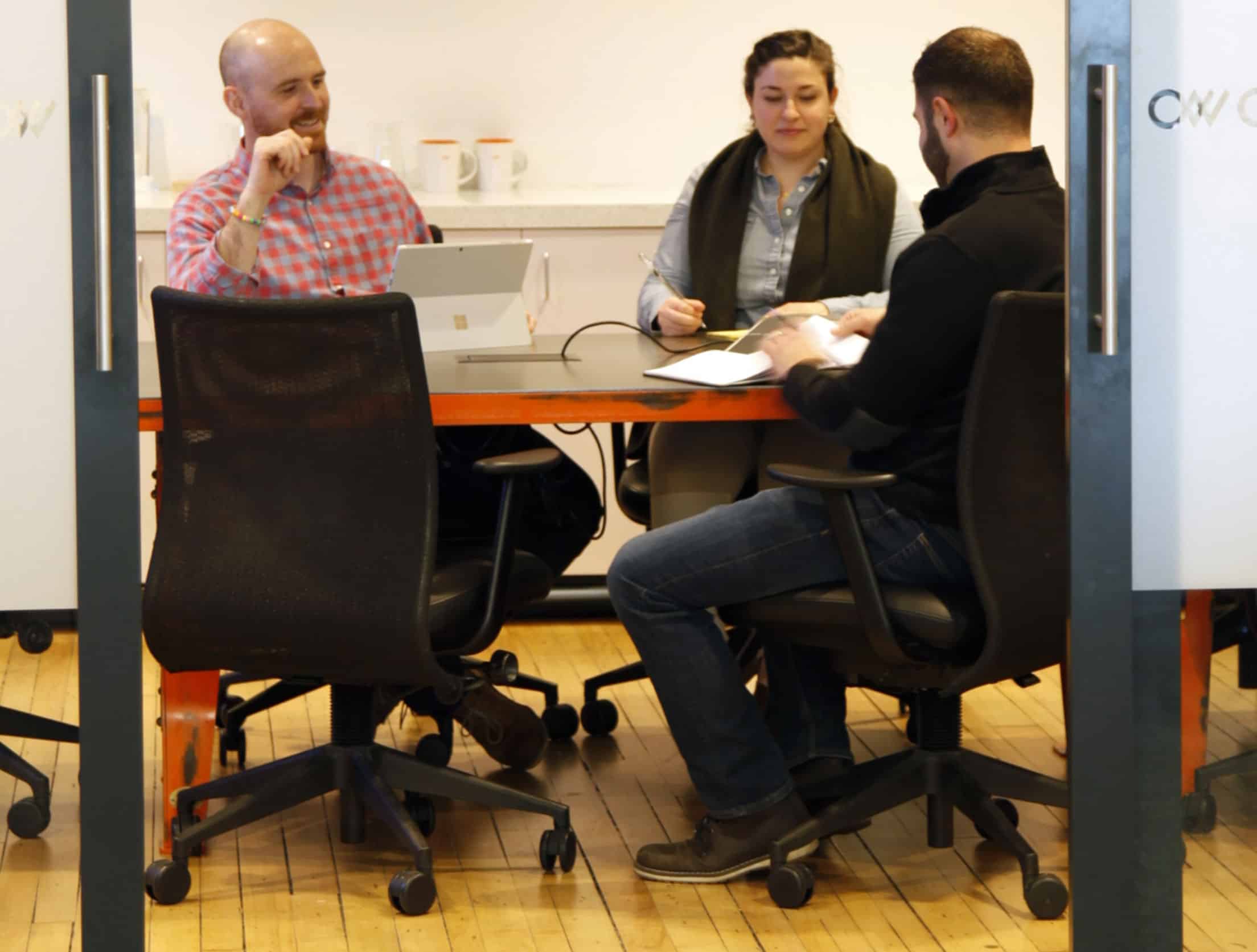 People holding a meeting in a conference room.